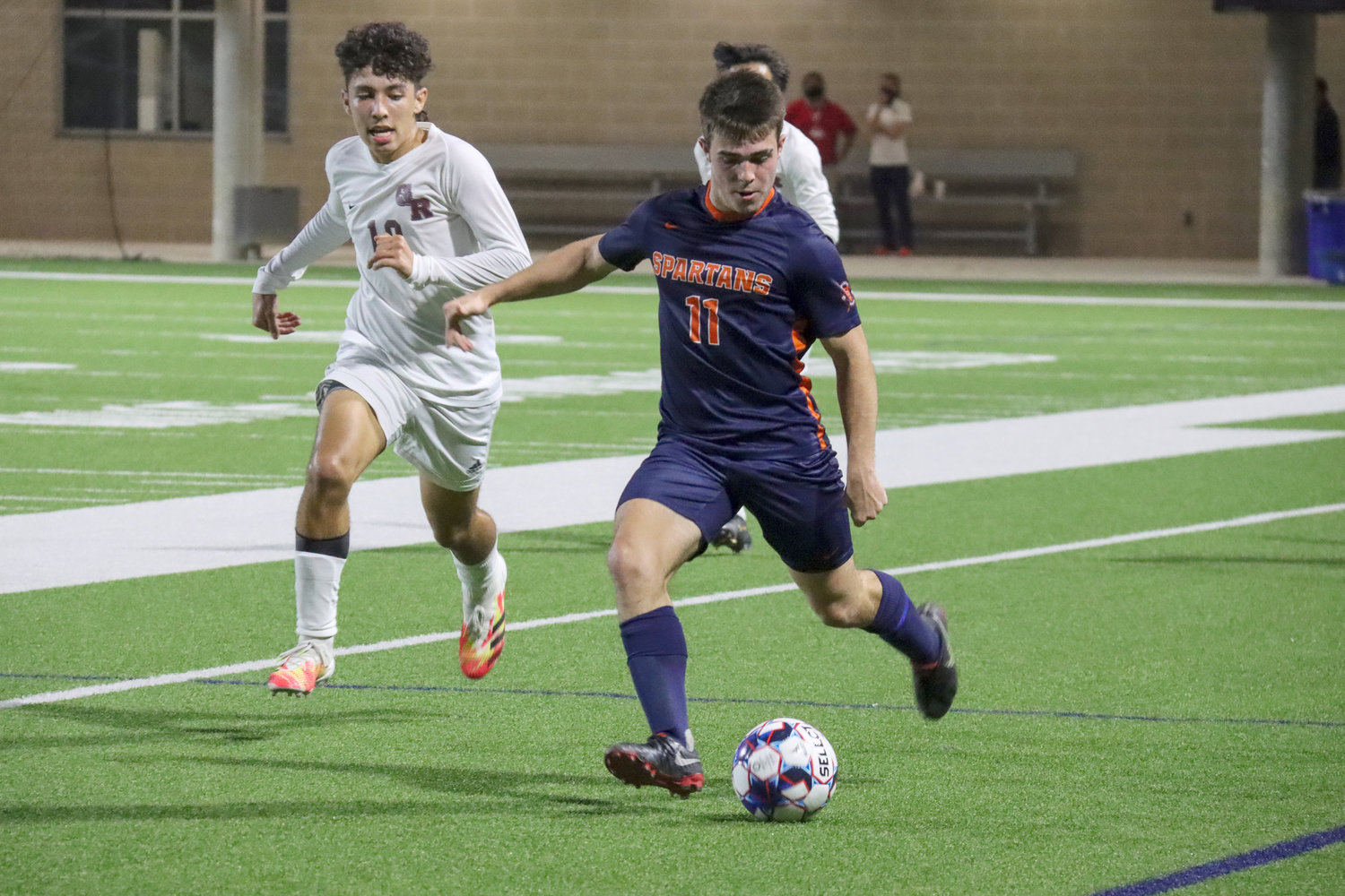 Seven Lakes senior Matt Stewart controls possession during the Spartans’ 5-2 Class 6A bi-district playoff win over George Ranch on Friday, March 25, at Legacy Stadium.